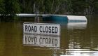 Protesters rally as Australian PM tours flood disaster zone